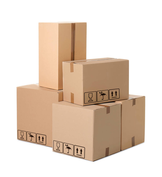 Parcel delivery. Cardboard boxes with different packaging symbols on white background   - Fotoğraf, Görsel
