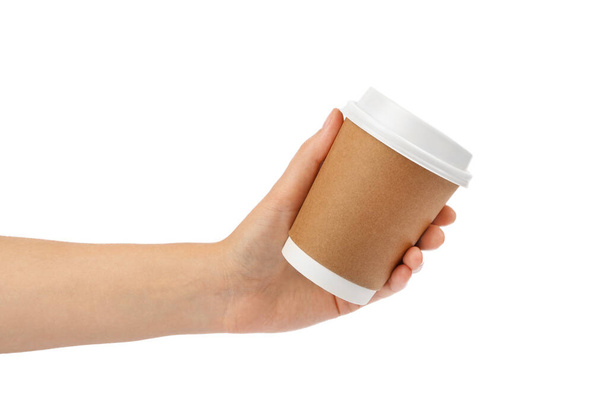 Woman holding takeaway paper coffee cup on white background, closeup - Fotó, kép