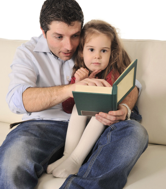 Father telling fairy tale to cute little daughter - Photo, Image