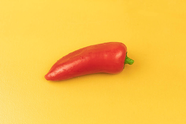 Fresh paprika on a yellow background. Fresh vegetables. Bell pepper - 写真・画像