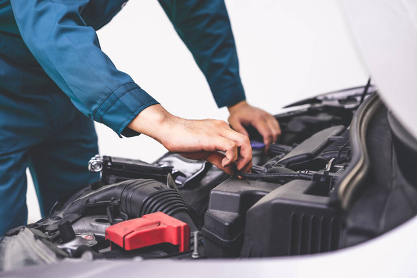 Professional mechanic hand providing car repair and maintenance service - Photo, Image