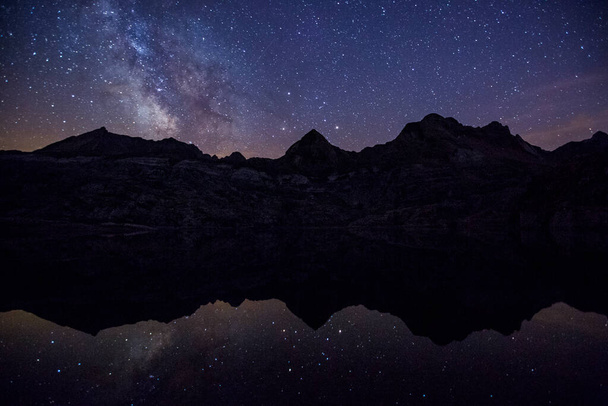 Summer night under Milky way in Ibon De Estanes lake, Aragon Pyrenees, Spain - Φωτογραφία, εικόνα