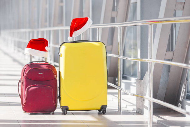 Suitcases christmas background. Traveling concept - Foto, afbeelding