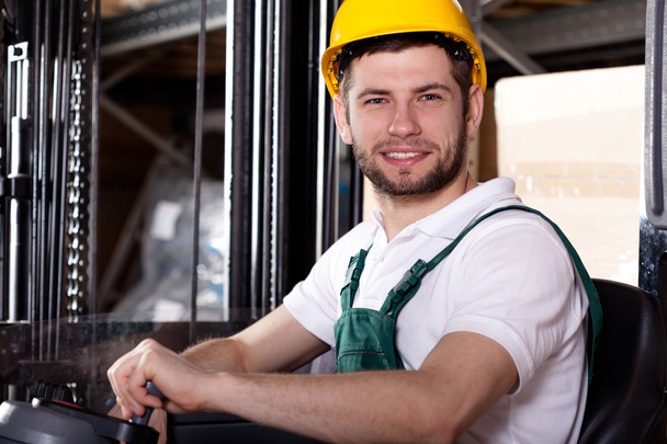 Storehouse worker on forklift - Photo, Image