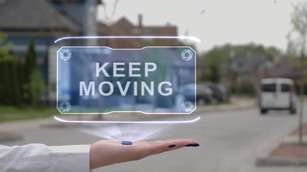 Weibliche Hand zeigt Hologramm Keep moving - Filmmaterial, Video