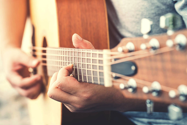 Man's hands playing acoustic guitar - Photo, Image