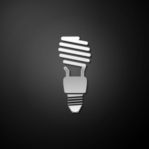 Stříbrná energeticky úsporná žárovka ikona izolované na černém pozadí. Dlouhý stínový styl. Vektor. - Vektor, obrázek