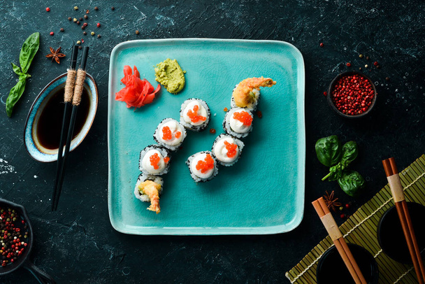 Sushi rolls with caviar and shrimp. Japanese food. Top view. Rustic style. - Φωτογραφία, εικόνα