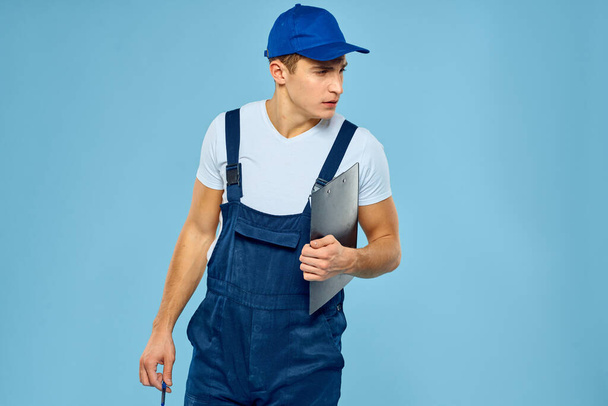 Delivery service man worker rendering service blue background - Fotó, kép