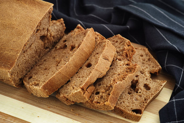 A loaf of homemade gluten free bread. Low key. - Foto, Imagem