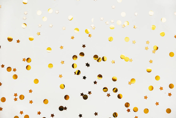 Scattered golden confetti background - Photo, Image