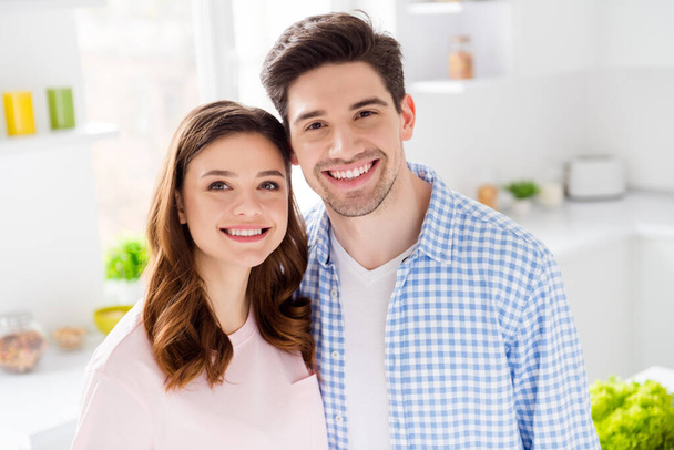 Close up photo of gentle cozy romantic romance spouses chef enjoy weekend leisure time feel dreamy cooking tasty healthy dinner dish meal wear checkered shirt in kitchen house indoors - Photo, image