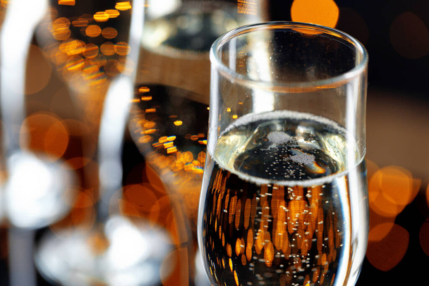 Close up photo of Champagne glasses against bokeh background - Photo, Image