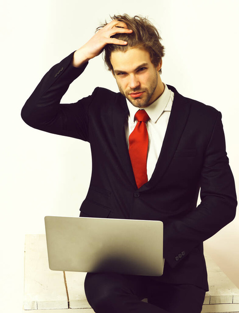 Caucasian stylish business man holding laptop - Photo, image