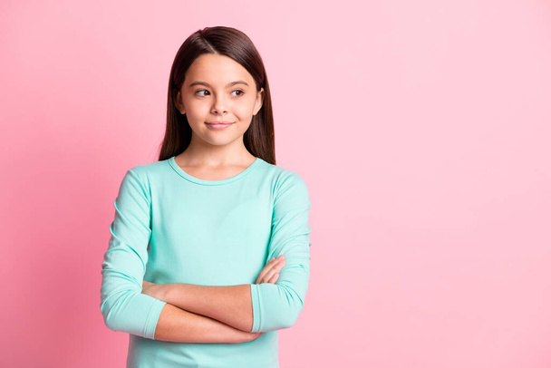 Portrait of her she nice attractive pretty charming cheery pensive long-haired girl folded arms looking aside copy empty blank space place isolated over pink pastel color background - Foto, imagen