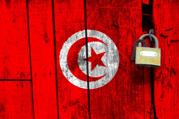 La bandiera tunisina è sulla trama. Modello. Pandemia di coronavirus. I paesi possono essere chiusi. Serrature. - Foto, immagini