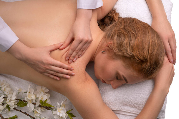 woman doing massage on back of client - Photo, image