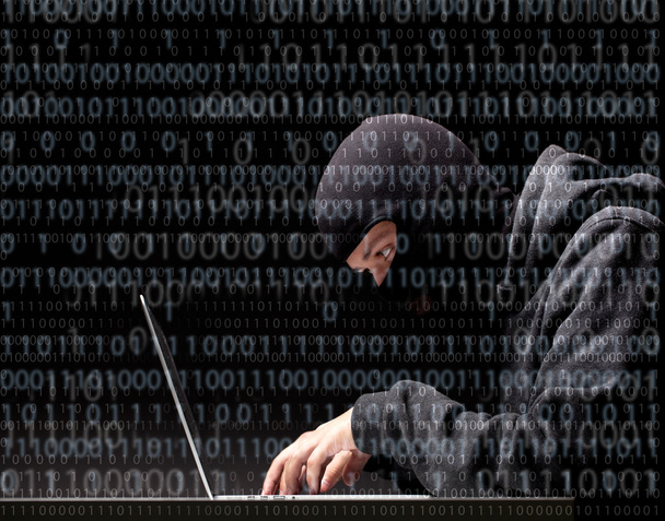 Computer hacker in a balaclava - Фото, зображення