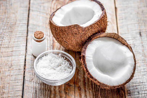 organic cosmetics with coconut on wooden background - Foto, afbeelding