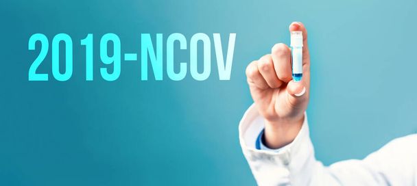 2019-NCOV theme with a doctor holding a laboratory vial - Fotoğraf, Görsel