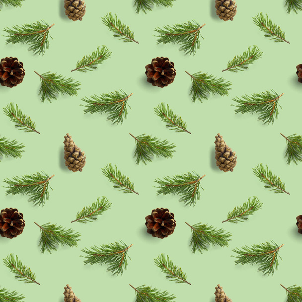 christmas seamless pattern from Pine cones, pine twig, needles on green background. modern pine cone christmas collage. Print for paper, fabric, wallpaper or background made frome pinecones. - Photo, Image