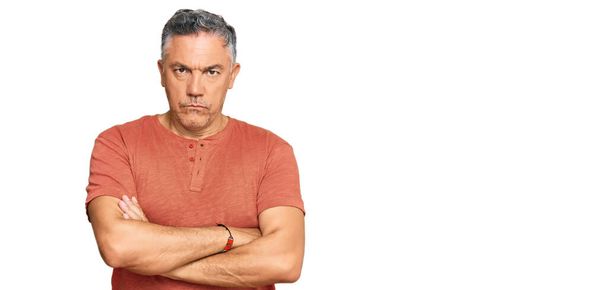 Handsome middle age man wearing casual clothes skeptic and nervous, disapproving expression on face with crossed arms. negative person.  - Photo, Image