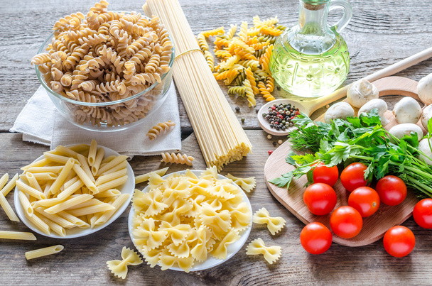 Various types of pasta with mushrooms and cherry tomatoes - Photo, image