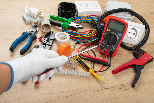 Tools for electrician needs: shocket multimeter, voltage testers, wire strippers, pliers, - 写真・画像
