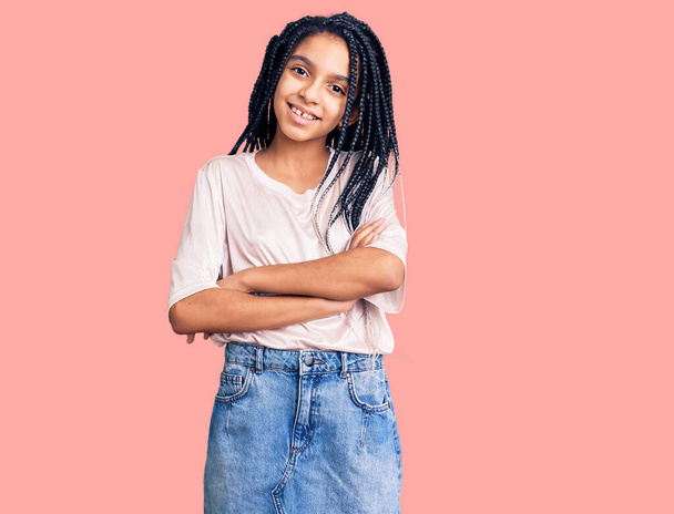 Cute african american girl wearing casual clothes happy face smiling with crossed arms looking at the camera. positive person.  - Foto, Imagem