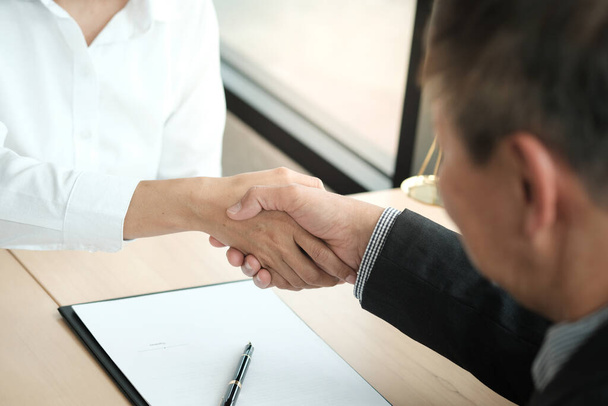 Lawyer handshake with client. Business partnership meeting successful concept  - Photo, image