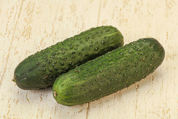 Green fresh two cucumbers over background - Photo, Image