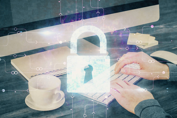 Multi exposure of lock icon with man working on computer on background. Concept of network protection. - 写真・画像
