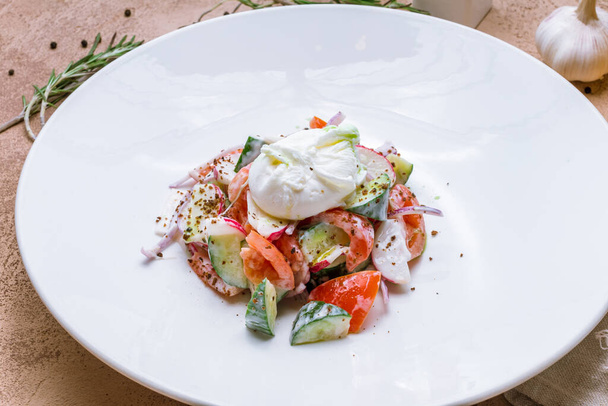 Beautiful fresh vegetable salad with poached egg on plate - Zdjęcie, obraz