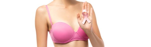 Horizontal image of young woman in pink bra holding ribbon of breast cancer awareness isolated on white - Foto, Imagen