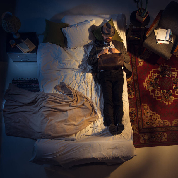 Portrait of a businessman, accountant sleeping in the bed at home - Fotoğraf, Görsel