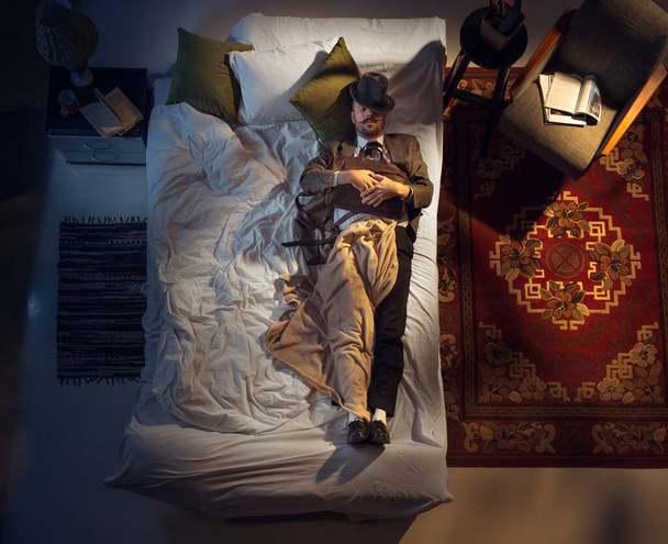 Portrait of a businessman, accountant sleeping in the bed at home - Foto, Imagem