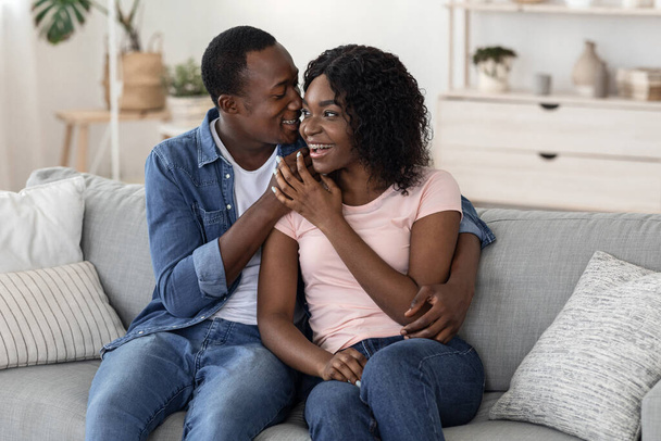 Happily married black couple bonding at home - Photo, Image
