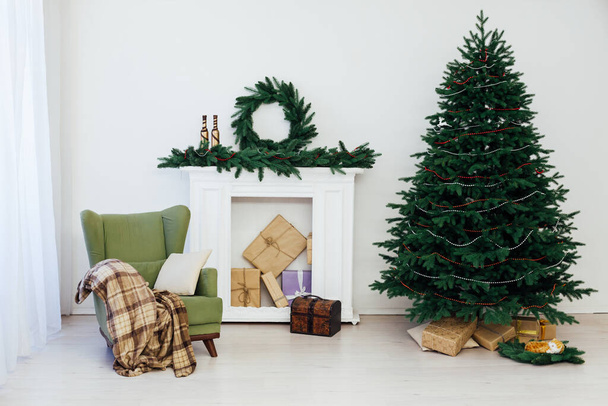 Christmas tree with fireplace interior of the house new year decor - Photo, Image