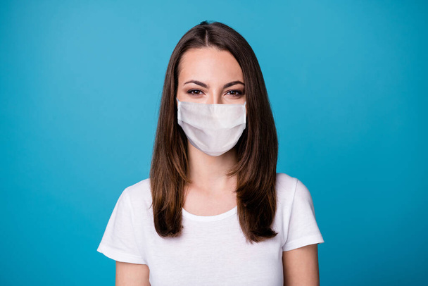 Closeup photo of attractive pretty lady good mood charming cute straight hairstyle wear casual white t-shirt medical mask isolated blue color background - Foto, Bild