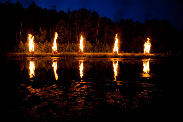 Bonfires on the river on the holiday of Ivan Kupala - Photo, Image