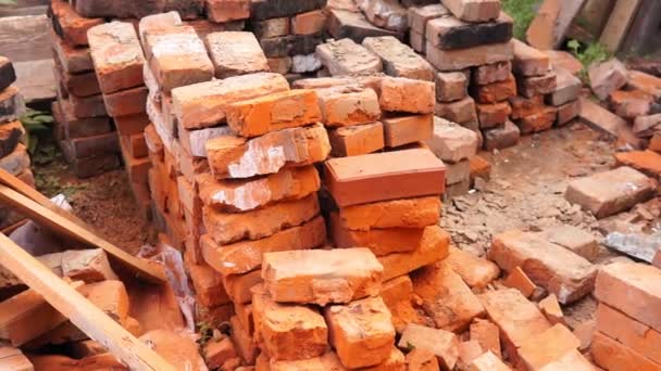 red bricks pile. stack for construction. Repair, industrial brickwork parts, construction equipment. - Footage, Video