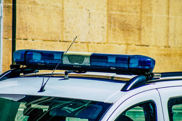 Closeup of an official police car patrolling the streets of the city center of the metropolitan area - Fotoğraf, Görsel