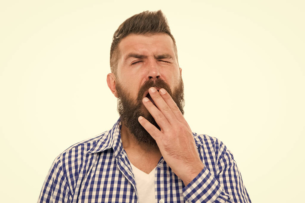 Boring concept. Man bored yawning white background. Fed up. Feel tired and sleepy. Sleepy guy. Bored worker yawning. Hipster cover mouth with palm while yawning. Why people yawn. Show indifference - Zdjęcie, obraz