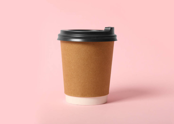 Takeaway paper coffee cup on pink background - Fotó, kép