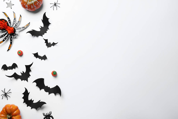 Halloween decor elements on white background, flat lay. Space for text - Фото, зображення