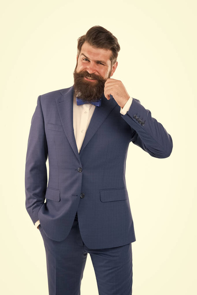 Buying bespoke suit. custom tailored suit for him. happy man touch moustache. business suits on any occasion. ready for job interview. classical jacket design. beard hair care. mature and charismatic - Fotografie, Obrázek