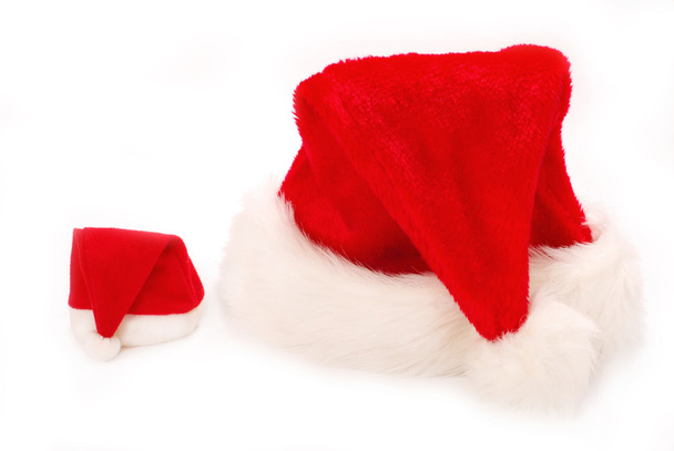 Chapéus de Papai Noel grandes e pequenos
 - Foto, Imagem