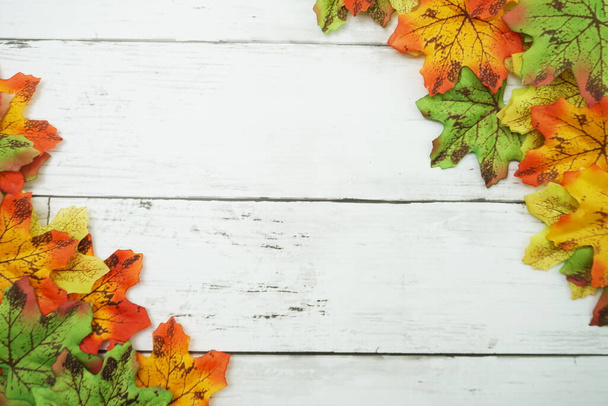 Autumn Maple leave border frame on wooden background - Photo, image