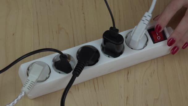 close up of female finger switch off plug extension cord. 4K - Footage, Video