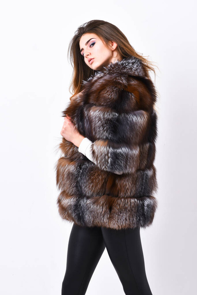 Woman makeup and hairstyle posing mink or sable fur coat. Female brown fur coat. Fur store model enjoy warm in soft fluffy coat with collar. Fur fashion concept. Winter elite luxury clothes - Photo, Image